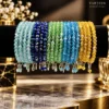 Set of five multicolour crystal beaded bangles in sky blue, royal blue, emerald green, turquoise, and amber gold for women