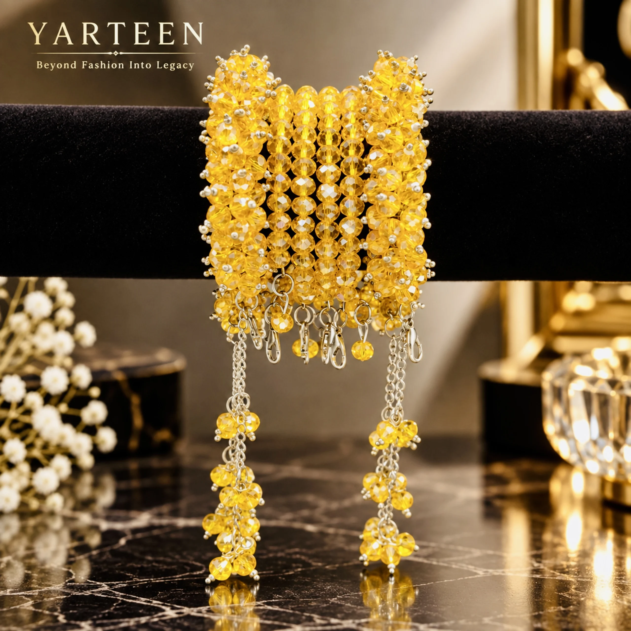 Yellow crystal gajra bracelet with silver accents and hanging tassel chains for mehndi and mayun