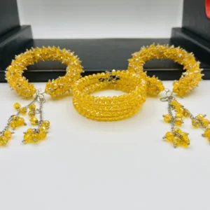 Yellow crystal gajra bracelet worn on wrist showing adjustable fit and graceful tassel movement for mehndi celebrations