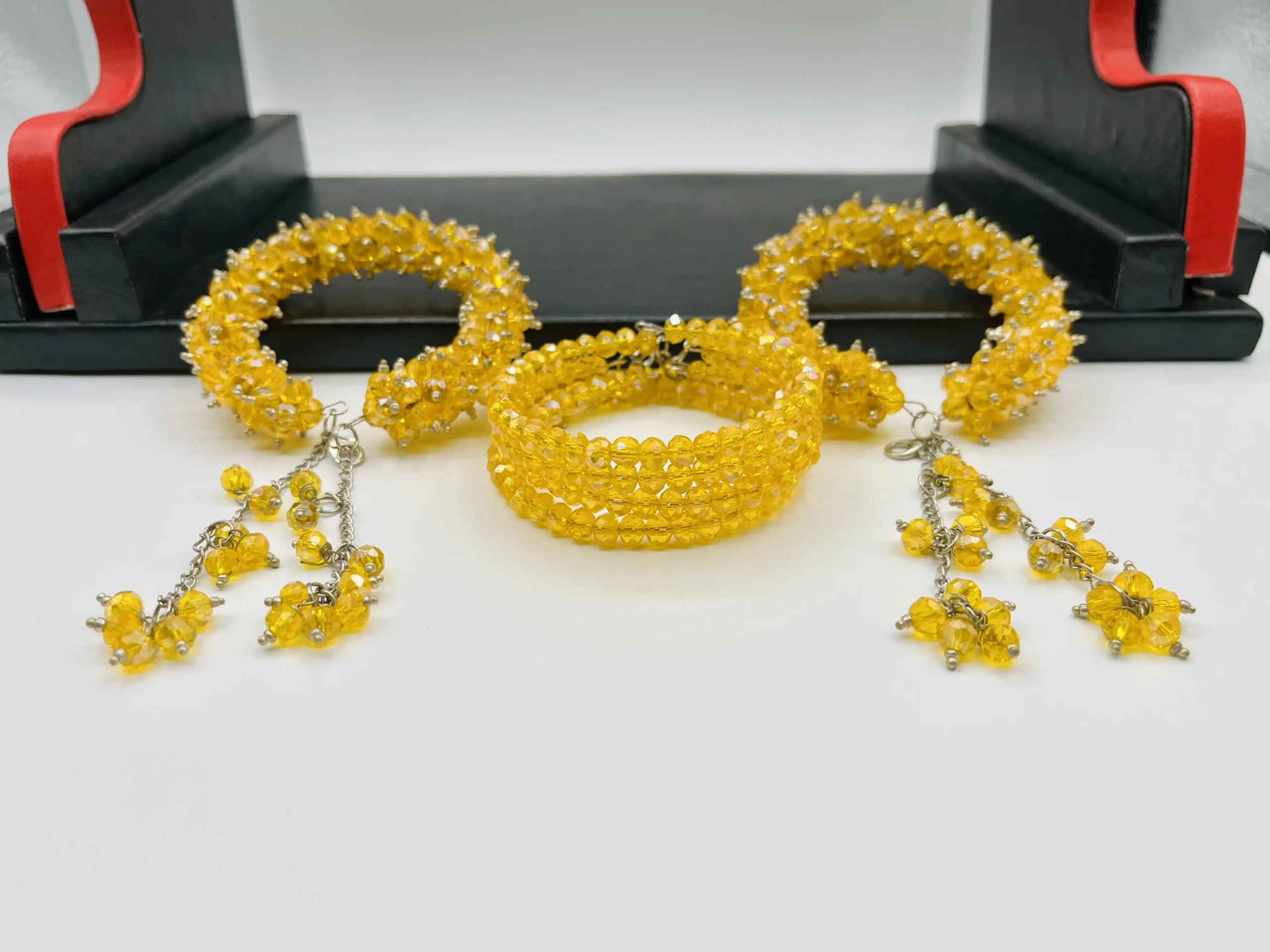 Yellow crystal gajra bracelet worn on wrist showing adjustable fit and graceful tassel movement for mehndi celebrations